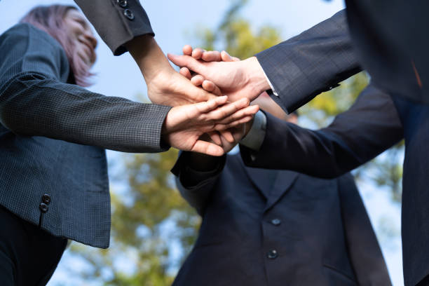 istock Eco business join hand together as teamwork and unity. Gyre 1981592348