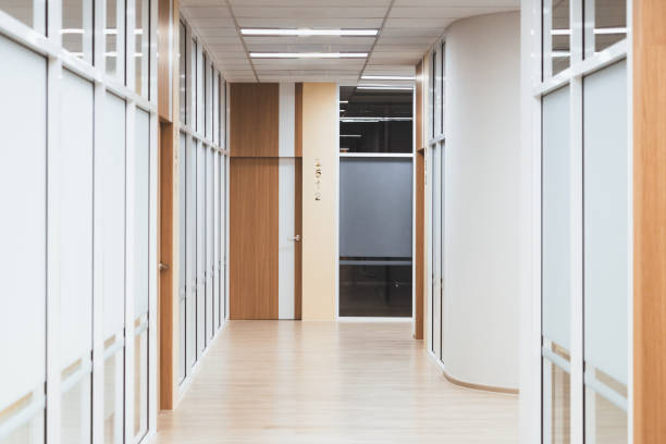 istock Empty modern office bright corridor with glass wall. Hall way. Ornamented. 1981606995