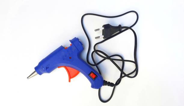 istock Blue electric glue gun on white background. 1981621086
