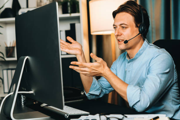 istock Call center consulting with customer on headphones on business graph. Pecuniary. 1981680616