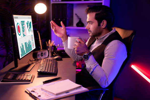 istock Smart businessman meeting product database while holding coffee cup. Surmise. 1981685831