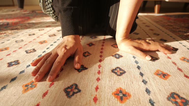 women hand touching new home carpet