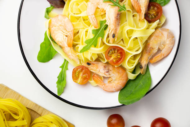istock Homemade pasta with shrimp and tomatoes 1981772859