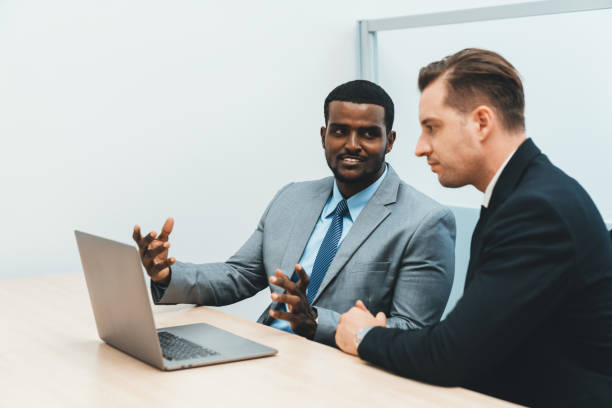 istock Cooperative handsome african businessman present start up project. Ornamented. 1981777031