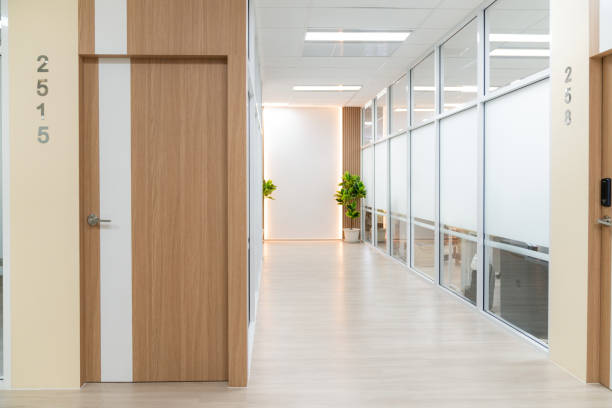 istock Empty modern office bright corridor with glass wall. Hall way. Ornamented. 1981784315