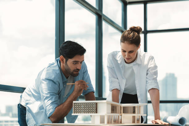 istock Smart architect engineer team working together to measure house model. Tracery. 1981793164