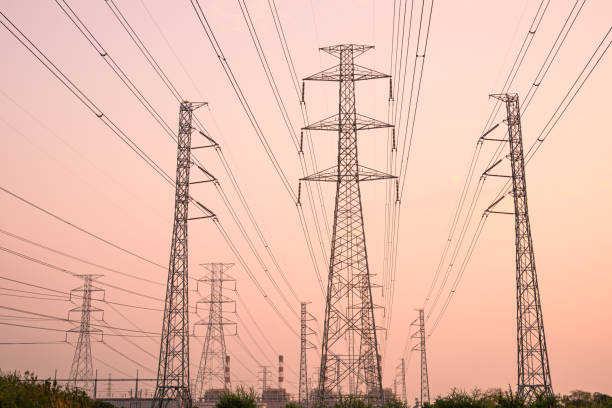 istock silhouette high voltage pole on sky sunset background. 1981816782