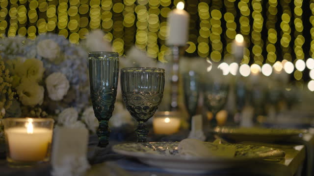 Wine glasses night dinner. Candle light bright romantic setting of wedding party table.