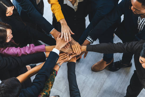 istock Diversity people putting their hands together. Showing unity. Intellectual. 1981829292