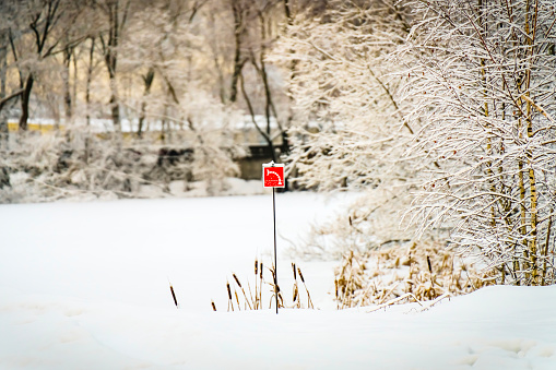 Fire pond sign near frozen lake