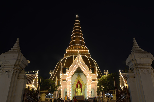 Nakhon Pathom,Thailand - October 31,2022 : Night time of Phra Pathom Chedi which is the largest pagoda in Thailand and the colors of lights on Loy Krathong Day on October 31,2022 . Located at Nakhon Pathom Province in Middle of Thailand.