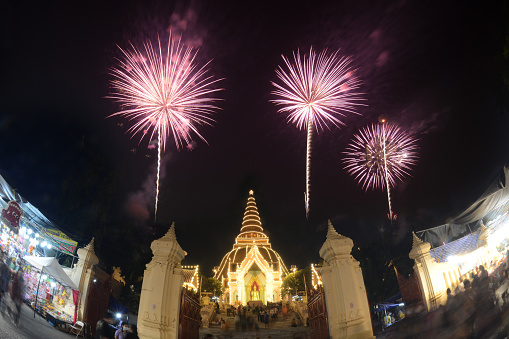 Nakhon Pathom,Thailand - October 31,2022 : Night time of Phra Pathom Chedi which is the largest pagoda in Thailand and the colors of the fireworks on Loy Krathong Day on october 31,2022. Located at Nakhon Pathom Province in Middle of Thailand.