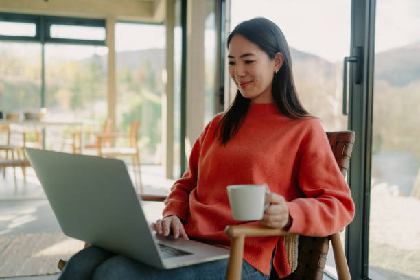 istock Japanese woman using a laptop 1981969081