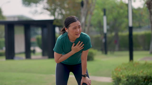 Asian woman was sick with chest pain while exercising at public park.