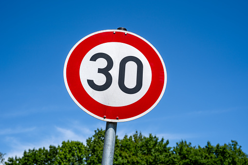 A British road sign for a 30 mile per hour speed limit area.