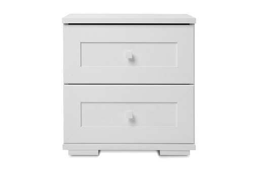 white wooden bedside table with drawers isolated on a white background