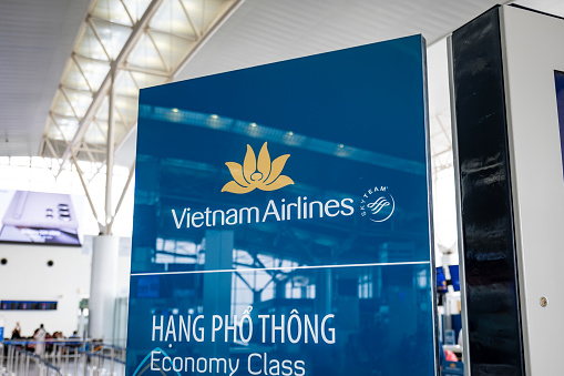 Hanoi, Vietnam - 12.18.2023: Vietnam Airlines check-in counter area at Hanoi International Airport. Vietnam Airlines is the flag carrier of Vietnam