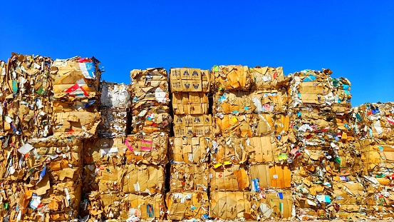 Old corrugated cartons bales in the raw material yard
