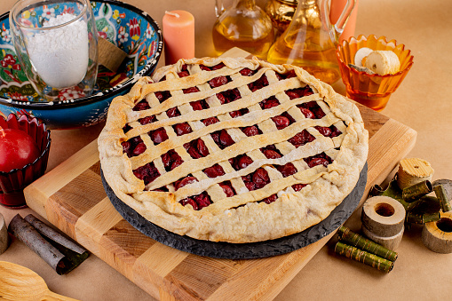 rustic cherry apple pie, on brown background
