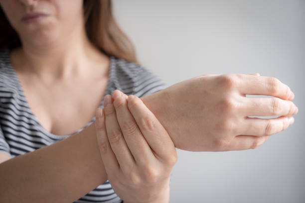 istock Woman suffering from pain in hand 1982176134