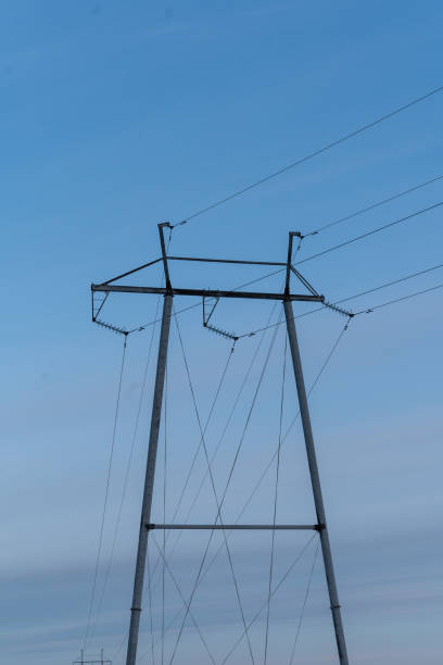 istock power tower and electric wires against blue sky 1982177591
