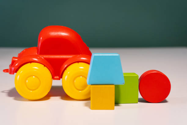a close up of toy car and some building blocks