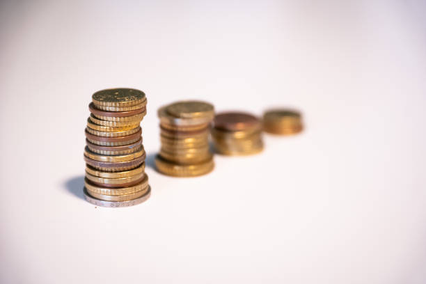 close up of piles made out of coins