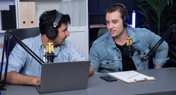 istock Host channel of smart influence broadcaster talking with guest. Sellable. 1982185366