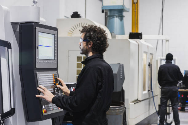 istock Engineer meticulously working on machinery. Industrial work concept. 1982223468