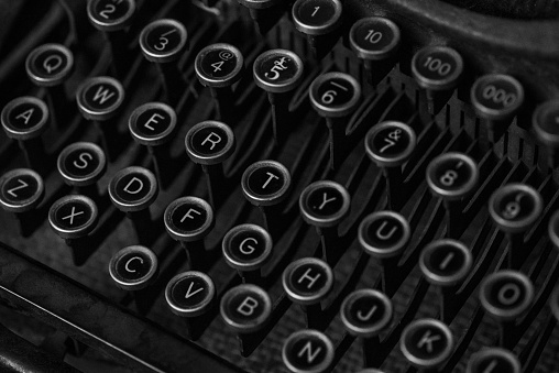 A closeup of the mechanical keys on an old typewriter