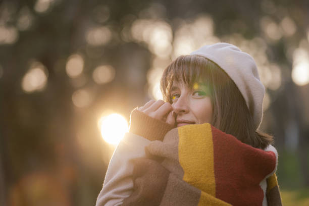 Portrait of young lady at public park in autumn.