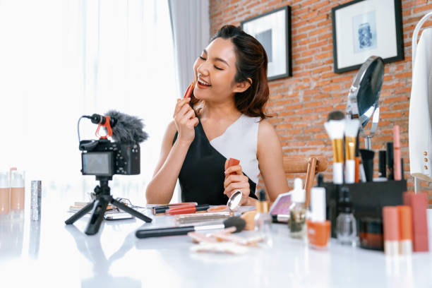 istock Woman influencer shoot live streaming vlog video review makeup uttermost social 1982257366