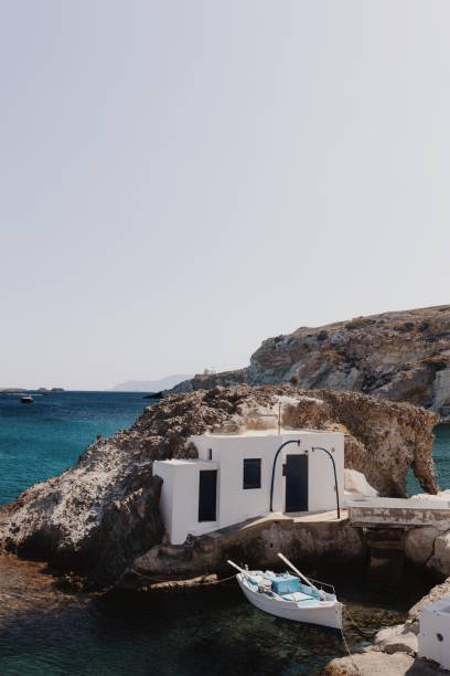 Scenic Elephant Bay in Stoupa, Kimolos, with a boat, Cyclades, Greece