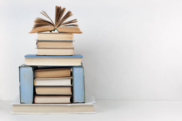 istock Open book, hardback colorful books on wooden table. Back to school. Copy space for text. Education business concept. 1982303815