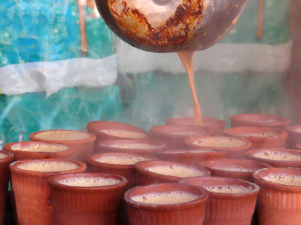 istock Multiple steaming hot Chai Masala Tea's being poured on the street 1982311252