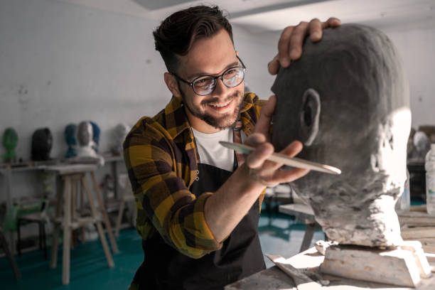 istock Young Man Sculpting a Head 1982316592