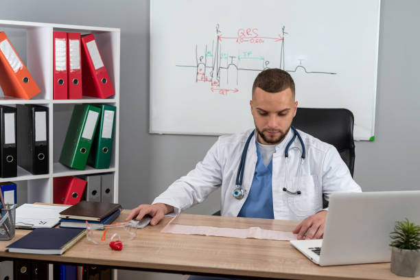istock Therapist practitioner wear white uniform coat with stethoscope working with patientes files 1982362897