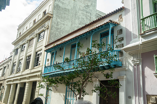 Colonial style building with balcony on the street of old Havana, Cuba