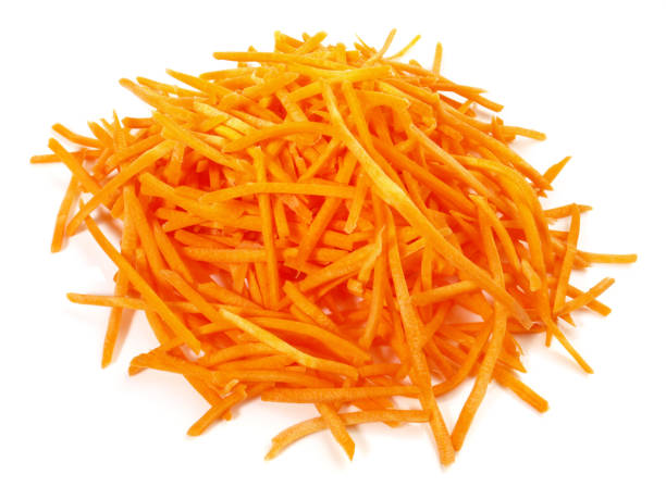 istock Fresh grated Carrots on white Background - Isolated 1982403888
