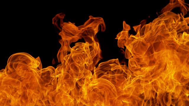 Super Slow Motion Detail Shot of Fire Flame Background Isolated on Black at 1000fps.