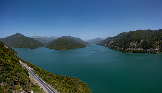 Zhinvali reservoir on the Aragvi River in Georgia in summer, horizontal panorama from a drone.