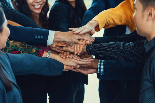 istock Diversity business people putting their hands together. Assemble. Intellectual. 1982458573
