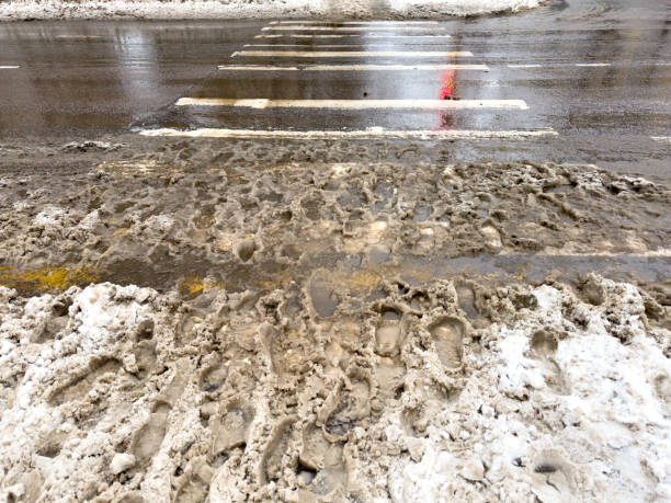 istock Pedestrian crossing on the road covered with snow 1982472953