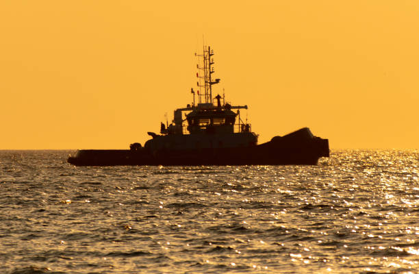 istock Boat at sea at sunset 1982497543