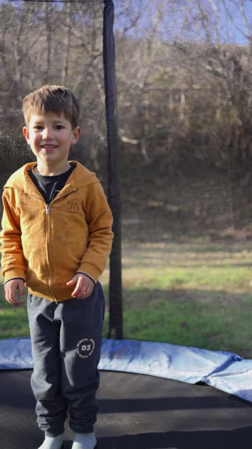 Child dancing in the trampoline