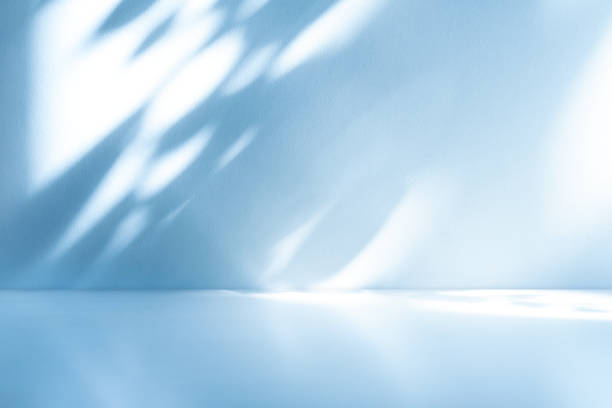 istock Wall interior background, studio, and backdrops show products. with shadow from window color white and blue light. background for text insertion and presentation of product 1982533101