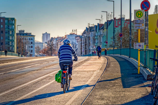 Berlin, Germany - January 28, 2024: Street scene with cyclists on a cycle path in Berlin.