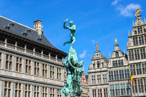 Antwerp, Belgium - April 2022: The Brabo Fountain, located on Antwerp's Grote Markt in the downtown region. The statue was made by the sculptor Jef Lambeaux in 1887. Antwerp is Belgium's most populous city and the capital of the Antwerp province, located in Flanders.