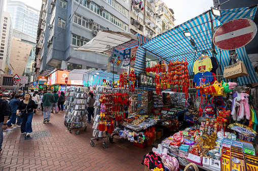 Hong Kong - February 3, 2024 : People at the Ladies’ Market on Tung Choi Street, Mong Kok, Kowloon, Hong Kong.
