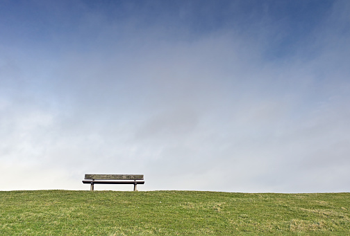 Empty bench on a dike